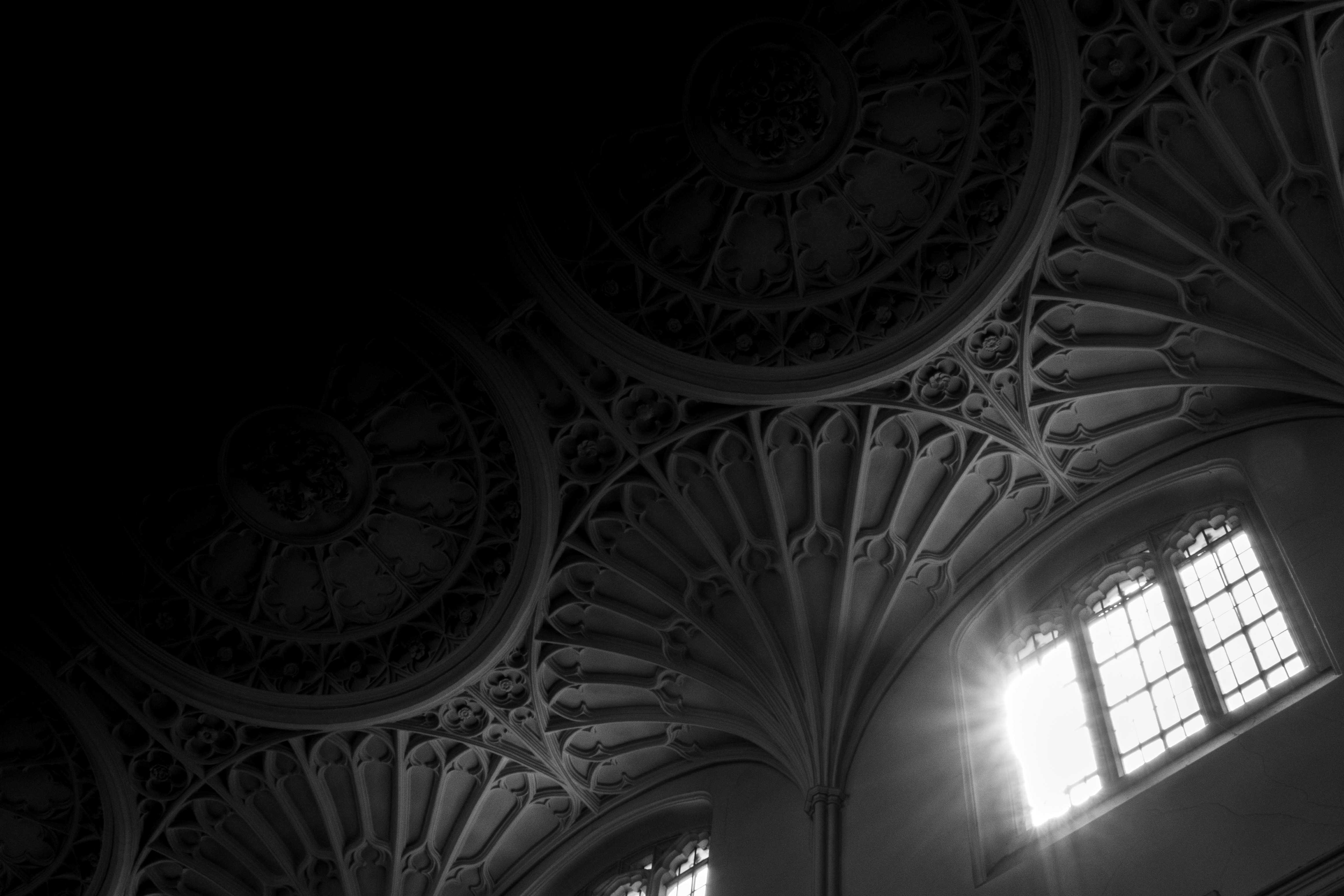 grayscale photo of round ceiling